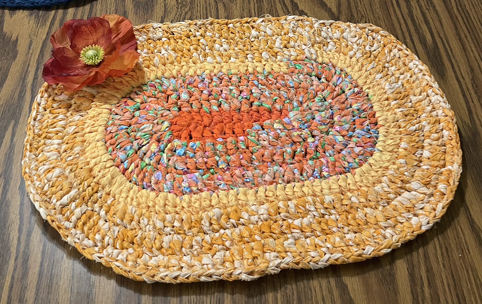 A photo of a rag rug placemat on a table.